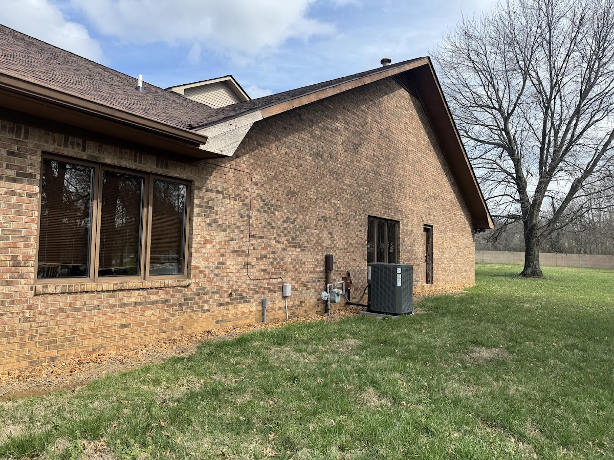 Brick house exterior with windows and trim work