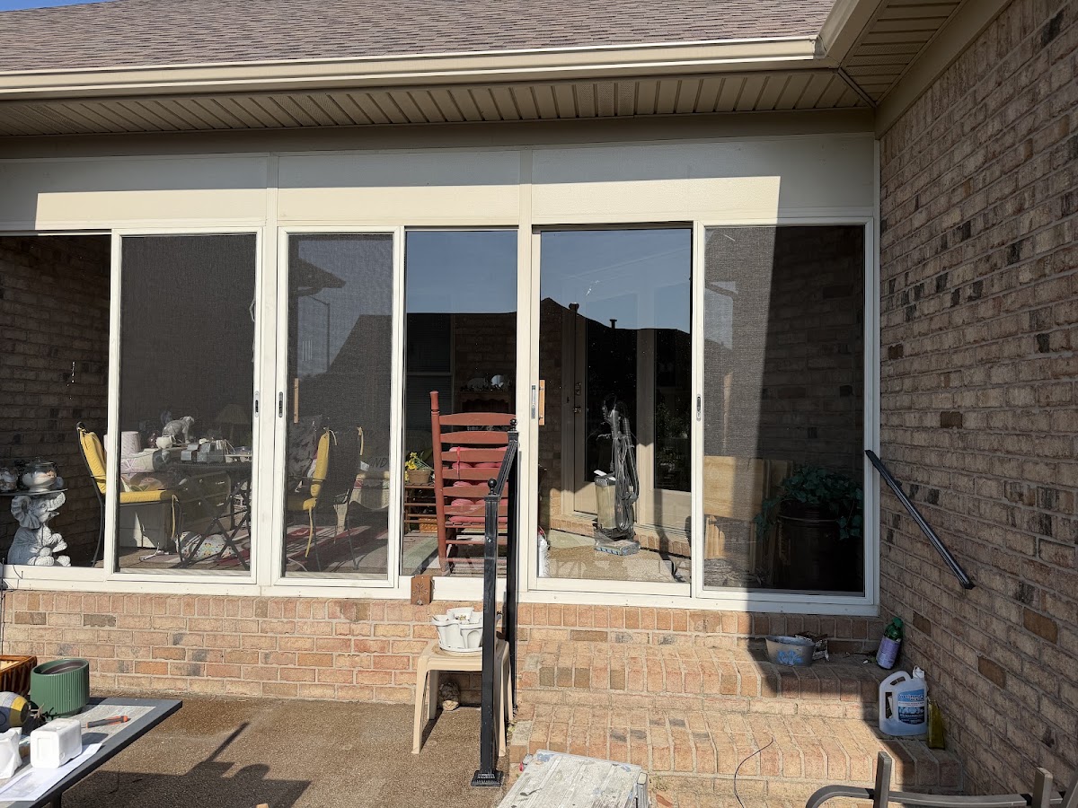 Rear patio with sliding glass doors and screens